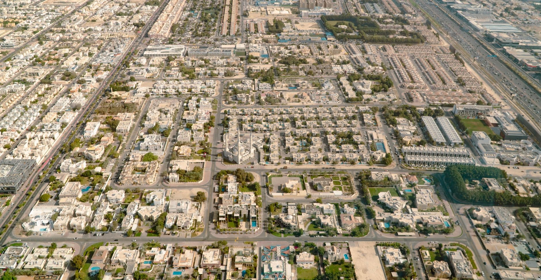 Aerial photo showing detailed layout of urban residential area with roads and buildings.