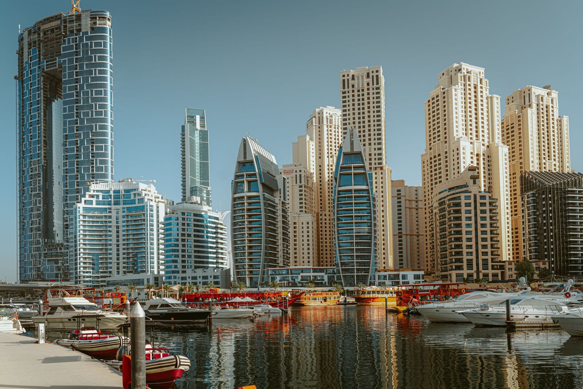 Panoramic view of Dubai Marina showing iconic skyscrapers and yachts